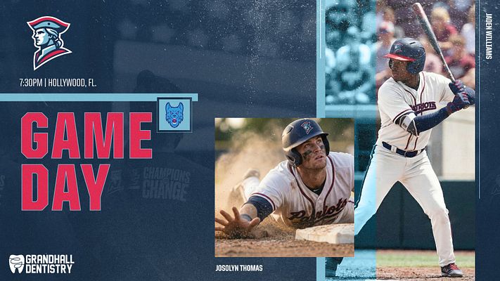 Multi-format gameday template with dark blue background, large red "GAME DAY" text, team logo, game time and location details, and three photo placeholders featuring baseball players. Designed for landscape, square, and portrait social media formats.