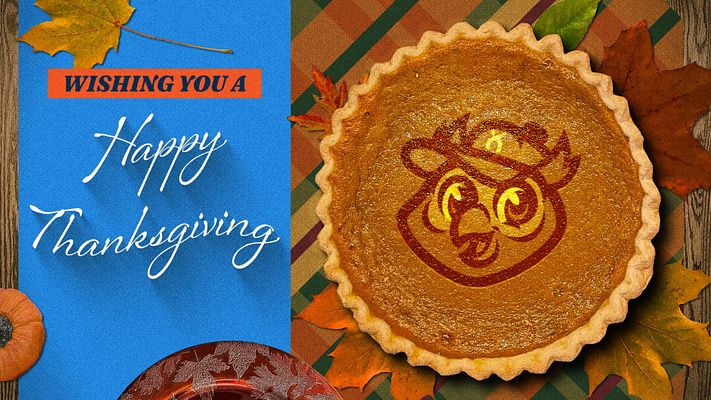 Thanksgiving template featuring bright blue section with 'Happy Thanksgiving' text on left, pumpkin pie with custom logo placeholder in center, autumn leaves and rustic wood background, ideal for holiday social media posts