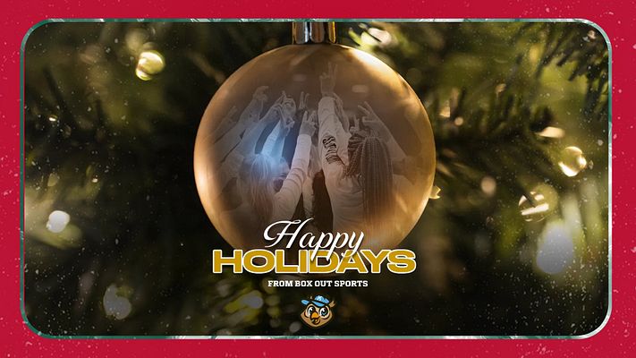 Holiday ornament template with red background, large golden ornament containing photo placeholder, white and gold "Happy Holidays" text, festive bokeh lighting effects, and space for team logo and branding